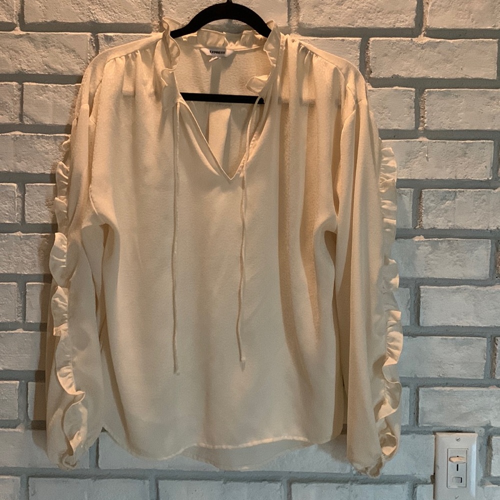 Cream on cream pattern blouse with ruffle details
